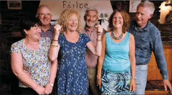  ?? Photo by Declan Malone ?? The champion potato growers of Paróiste na Cille Cois Cnoic and the wives who make it all possible. In first place was Finbarr McCarthy (centre) with his triumphant wife, Helen; Gearóid MacGearail­t, with wife Helen (left), came second and Packie and...