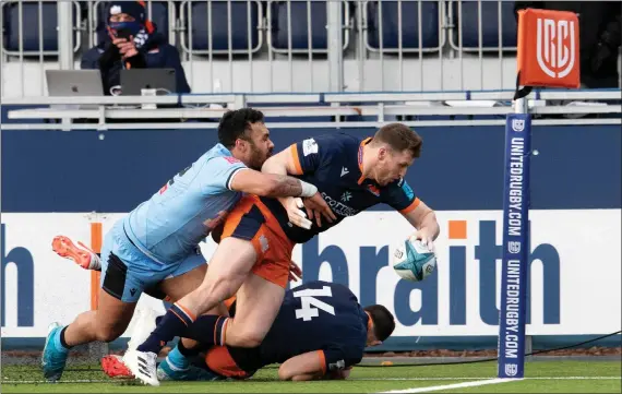  ?? ?? Mark Bennett scores his first, and Edinburgh’s third try in their 34-10 victory over Cardiff at the DAM Health Stadium