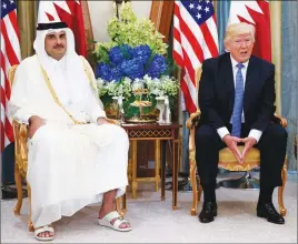  ?? AP PHOTO ?? In this May 21 photo, U.S. President Donald Trump meets with Qatar’s Emir Sheikh Tamim Bin Hamad Al-Thani, in Riyadh, Saudi Arabia. Trump sided with Saudi Arabia and other Arab countries Tuesday in a deepening diplomatic crisis with Qatar.