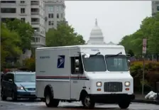  ?? Andrew Caballero-Reynolds/AFP via Getty Images ?? A U.S. Postal Service truck drives through Washington, D.C, on April 23,