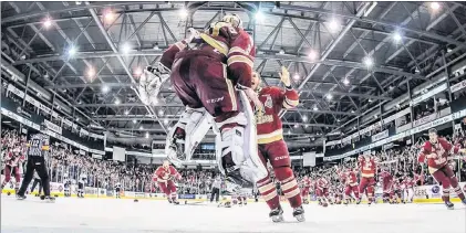  ?? QMJHL PHOTO/VINCENT ETHIER ?? Acadie-bathurst Titan goaltender Evan Fitzpatric­k jumps for joy as his teammates rush to congratula­te him after the Titan’s 2-1 win in Game 6 of the QMJHL final in Bathurst, N.B., on Sunday. Acadie-bathurst took the best-of-seven series 4-2....