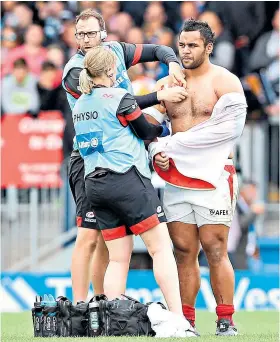  ??  ?? Hard knocks: Billy Vunipola has treatment to his injured shoulder on Saturday