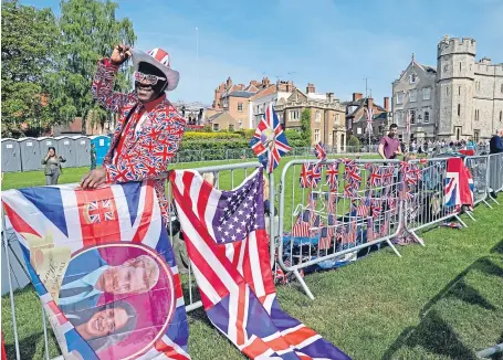  ?? Picture: PA ?? Royal fans in Windsor ahead of the eagerly anticipate­d ceremony.