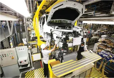  ??  ?? Cars made at General Motors’ plant in Rayong province are exported around the globe.