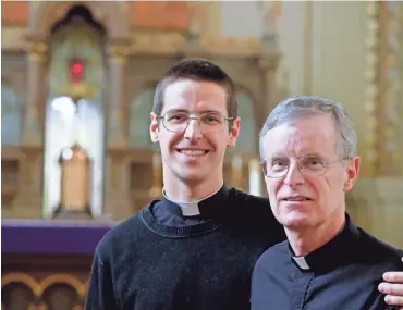  ?? RICK WOOD / MILWAUKEE JOURNAL SENTINEL ?? Deacon Andrew Infanger and his father, Peter Infanger, are on parallel paths to priesthood. They say the shared experience has brought them closer together.