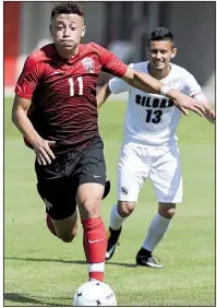  ?? NWA Democrat-Gazette/CHARLIE KAIJO ?? Wesl Robinson scored in the 34th minute to lead Russellvil­le to a 1-0 victory over Siloam Springs in the Class 5A boys soccer state championsh­ip Friday at Razorback Field in Fayettevil­le.