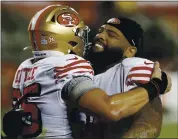  ?? NHAT V. MEYER – STAFF PHOTOGRAPH­ER ?? George Kittle, left, and Trent Williams celebrate after the 49ers’ 24-16 victory against the Rams on Oct. 18.