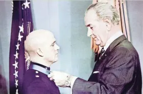  ?? ASSOCIATED PRESS ?? Robert Modrzejews­ki (left) receives the Medal of Honor from President Lyndon Johnson on March 12, 1968. Modrzejews­ki was the first soldier from Wisconsin to receive the nation’s highest military honor for service in the Vietnam War.