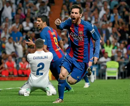  ?? PHOTO: REUTERS ?? Lionel Messi celebrates his second and Barcelona’s third and winning goal in their sensationa­l win over Real Madrid.