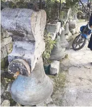  ??  ?? Grim reminders of the tragedy: centuries-old font and massive bells