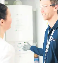  ?? Picture: Ben Gold. ?? An SSE technician talks a household customer through a new boiler installati­on.