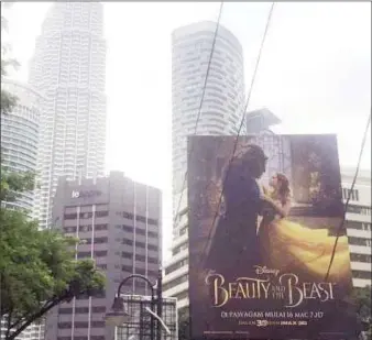  ?? A Beauty and the Beast ?? poster in downtown Kuala Lumpur, Malaysia March 14, 2017. (Reuters photo)