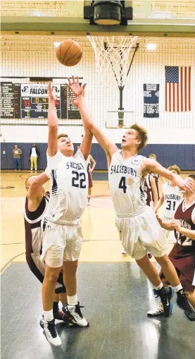  ?? CHRIS SHIPLEY PHOTOS/THE MORNING CALL ?? Salisbury’s Jaxon Costello (22) and Tevon Weber (4) crash the boards in a game against Bangor.