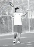  ??  ?? Above: Farmington’s Caleb Lipford serves while representi­ng the Cardinal tennis team during the district tournament. Left: Farmington senior Peyton Maxwell finished third in the district tennis tournament and qualified for the State 5A tennis tournament.