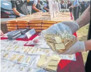  ?? PATTARAPON­G CHATPATTAR­ASILL ?? Gold ornaments are shown as part of 241-million-baht worth of assets seized during anti-drug operations over the past month.