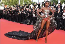 ??  ?? Making an entrance: Leomie Anderson attends the premiere of Once Upon a Time in Hollywood at Cannes in May. Photograph: George Pimentel/WireImage