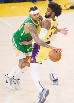  ??  ?? JORDAN CLARKSON of the Utah Jazz (left) tries to keep his dribble as he collides with Wesley Matthews of the Los Angeles Lakers during the third quarter at Staples Center in Los Angeles, California. The Jazz won 111-97 as Clarkson scored 22 off the bench. (AFP)