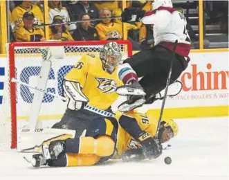  ?? Andy Cross, The Denver Post ?? Avalanche defenseman Tyson Barrie sails over sliding Predators defensman P.K. Subban in the second period of Saturday afternoon’s game in Nashville, Tenn. Barrie took a puck to the face earlier in Colorado’s 5-4 loss in their opening-round playoff...