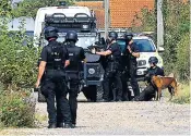  ??  ?? Armed officers surrounded the house on the South coast as efforts continued to convince the man to give himself up