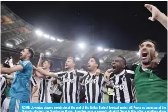  ??  ?? ROME: Juventus players celebrate at the end of the Italian Serie A football match AS Roma vs Juventus at the Olympic stadium on Sunday in Rome. Juventus won a seventh straight Serie A title after a goalless draw against ten-man Roma. —AFP