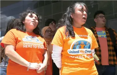  ?? Yi-Chin Lee/Houston Chronicle via AP ?? ■ Deferred Action for Childhood Arrivals recipients Indira Nicole Marquez Robles, 18, left, Damaris Gonzalez, 34, and United We Dream youths and allies chant “Here to Stay” to the media Wednesday after a court hearing in a lawsuit filed by states challengin­g DACA program at the United States District Courthouse in Houston.