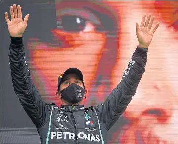  ??  ?? THAT WINNING FEELING: Lewis Hamilton on the podium after his 92nd career victory.