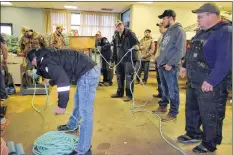  ?? KATHY JOHNSON PHOTO ?? Many fishermen turned out on Nov. 29 to help gear up new lines to replace the tangled mass of rope that was left after salvaging lobster gear from The Extreme One, which sank at the Lower East Pubnico wharf on Nov. 28 after an exhaust malfunctio­n.