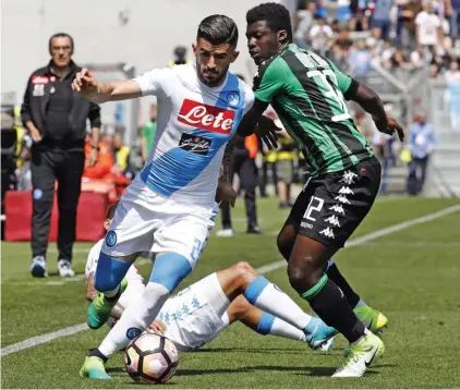  ??  ?? Sassuolo's Alfred Duncan, right, challenges Napoli's Elseid Hysaj