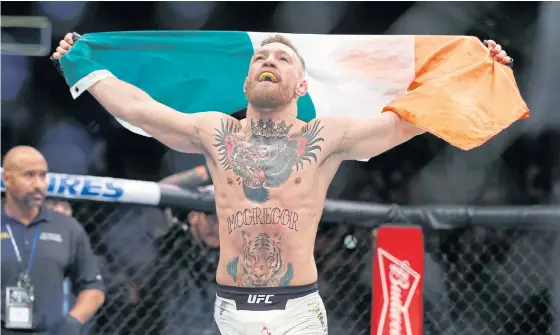  ??  ?? Conor McGregor celebrates after defeating Eddie Alvarez last month.