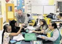  ??  ?? Shawn Flores in his classroom at Bruce Elementary School.