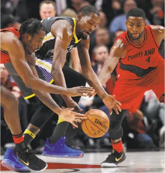  ?? Steve Dipaola / Associated Press ?? Kevin Durant goes after a loose ball in the Warriors’ loss at Portland. Durant scored 50 points, his highest total with Golden State. He went 17-for-27 from the floor and 10-for-10 at the line.