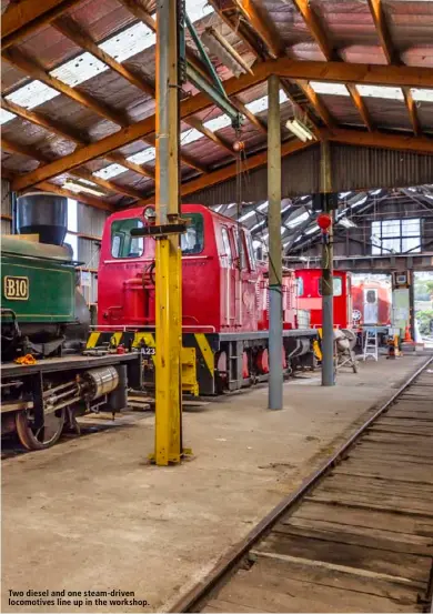  ??  ?? Two diesel and one steam- driven locomotive­s line up in the workshop.