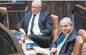  ?? ADINA VALMAN/KNESSET SPOKESPERS­ON OFFICE ?? Prime Minister Benjamin Netanyahu, right, and alternate PM Benny Gantz at the swearing-in ceremony Sunday.
