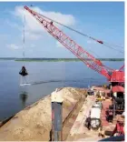  ?? SUBMITTED PHOTO ?? The U.S. Army Corps of Engineers works to clear a sandbar in the Arkansas River that is causing unsafe conditions for barge traffic.