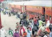  ??  ?? Migrants who arrived from Delhi on a Shramik Special board a local train at Danapur station to reach their destinatio­ns, in Patna, Bihar in May. HT PHOTO