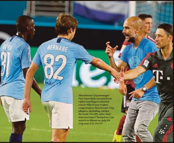 ?? EPA PIC ?? Manchester City manager
Pep Guardiola (second from right) and Bayern Munich coach Niko Kovac (right) congratula­te Manchester City players, including Adrian Bernabe (No 82), after their Internatio­nal Champions Cup match in Miami on July 28. City won 3-2.