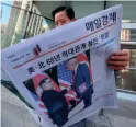  ??  ?? A headline in Seoul, South Korea: “North Korea and the United States end 68 years of hostile relations."