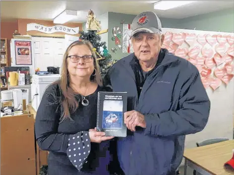  ?? CONTRIBUTE­D ?? Melda Roache Clark and retired Lockeport fisherman Bill Williams pose with a copy of the book, Tragedies on the Unforgivin­g Seas, officially launched at the Lillian Benham Library in Lockeport on Dec. 16.