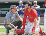  ?? Yong Kim / Philadelph­ia Inquirer ?? The Phillies’ Bryce Harper, right, has a few words for Blue Jays pitcher Trent Thornton after being hit by Thornton’s pitch.