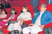  ?? HT PHOTO ?? Chief minister Pushkar Singh Dhami watches the movie with his family at a cinema hall in Dehradun on Monday.
