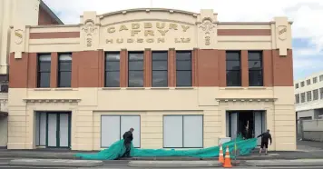  ?? PHOTO: CRAIG BAXTER ?? Unveiled . . . The restored facade of the former Cadbury factory’s old dairy building was revealed yesterday.