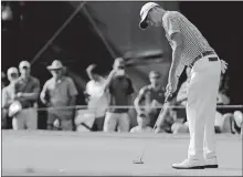  ?? DAVID GOLDMAN/AP PHOTO ?? Justin Thomas putts on the 17th hole Friday during the second round of the Tour Championsh­ip at East Lake Golf Club in Atlanta.