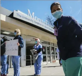  ?? ASSOCIATED PRESS FILE PHOTO ?? RIGHT: Nurses at Montefiore Medical Center Moses Division hold a outside the hospital, demanding N95s and other critical personal protective equipment to handle the COVID-19 outbreak in 2020 in New York.