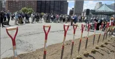  ?? Pam Panchak/Post-Gazette ?? Dignitarie­s gather for a ceremonial groundbrea­king for the I-579 Cap Project at the PPG Arena West Lot on Friday.