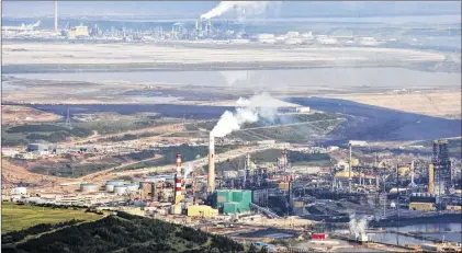  ?? CP PHOTO ?? The Suncor oil sands facility seen from a helicopter near Fort Mcmurray, Alta., July 10, 2012.