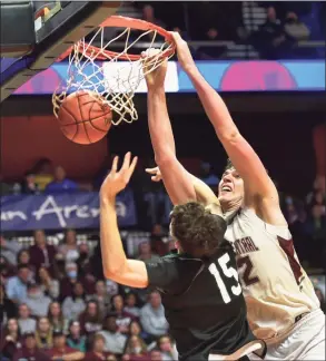  ?? Christian Abraham / Hearst Connecticu­t Media ?? Bristol Central's Donovan Clingan (32) dunks against Northwest Catholic during the Division II boys basketball championsh­ip at Mohegan Sun Arena in Uncasville on Saturday.