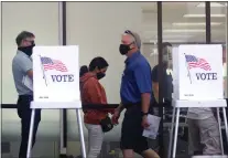  ?? ARIC CRABB — STAFF ARCHIVES ?? Community members line up to vote inside the Santa Clara County Registrar of Voters Office in September 2021in San Jose.