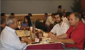  ??  ?? Eduardo Rivera (left), Calexico Chamber of Commerce board of director and John Renison (right), Imperial County District 1 Supervisor, attend Yum Yum Restaurant on Friday in Calexico. WILLIAM ROLLER PHOTO