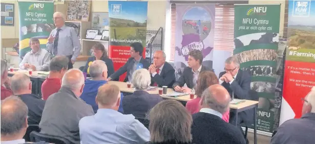  ??  ?? Election hustings, Mona Showground. L-R: Elwyn Evans, Anglesey NFU Cymru County Chairman: Tom Jones, Anglesey FUW President; Sarah Jackson, Liberal Democrats; Tomos Dafydd Davies, Conservati­ves, Albert Owen, Labour; Ieuan Wyn Jones, Plaid Cymru; James...