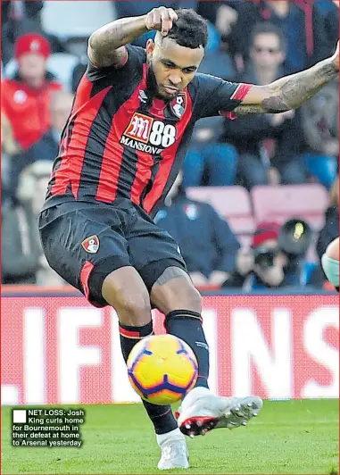  ??  ?? NET LOSS: Josh King curls home for Bournemout­h in their defeat at home to Arsenal yesterday